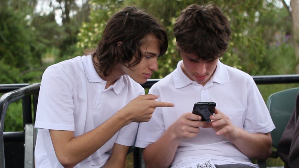 students looking at mobile phone