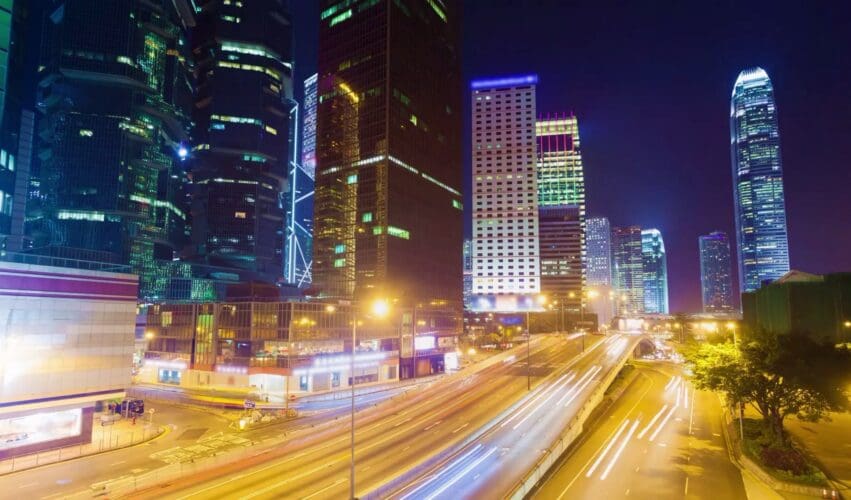 City skyline and traffic light trails at night, from the Broadband Solutions website video