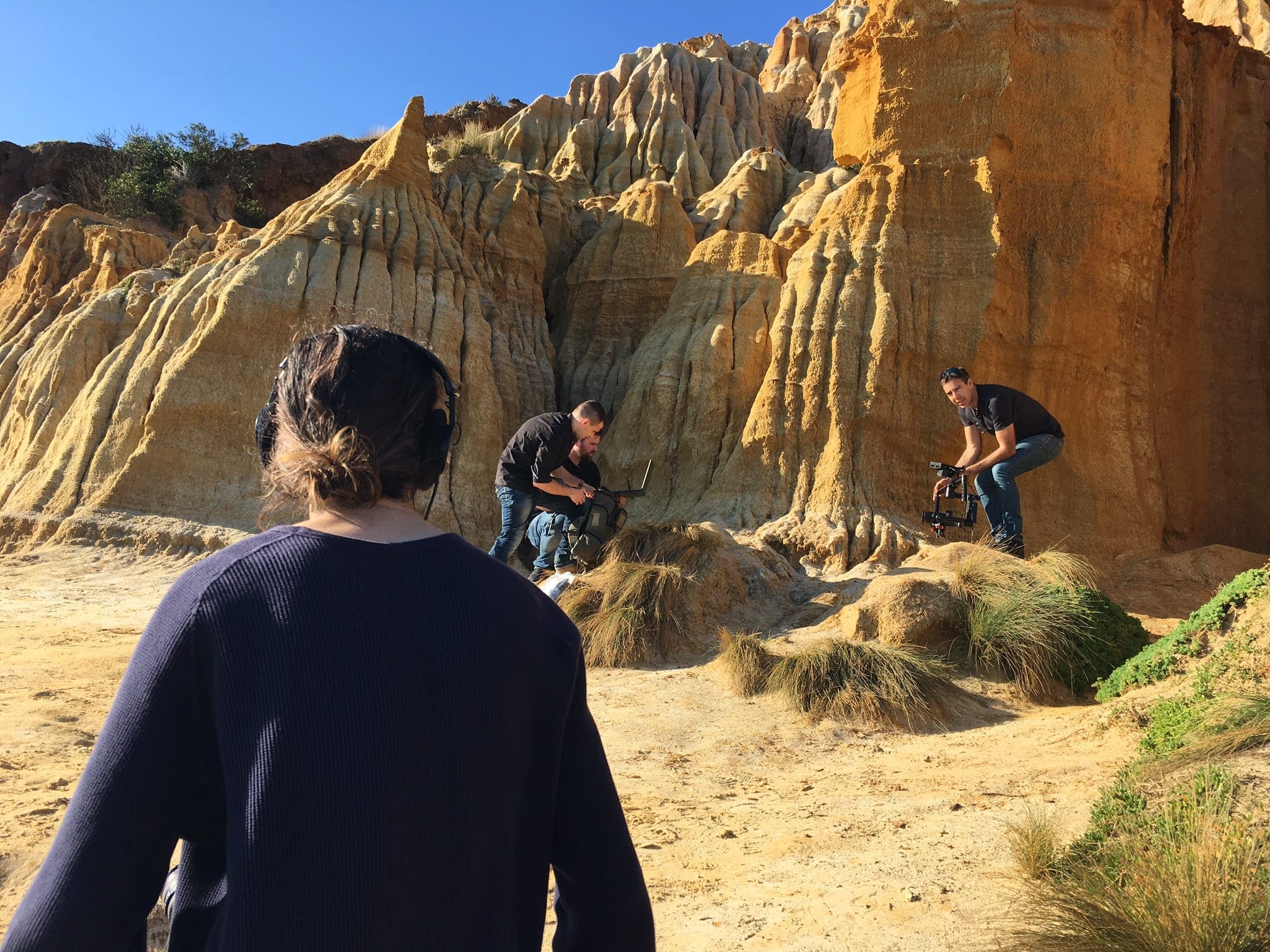 Dream Engine camera crew filming a production at coastal cliffs