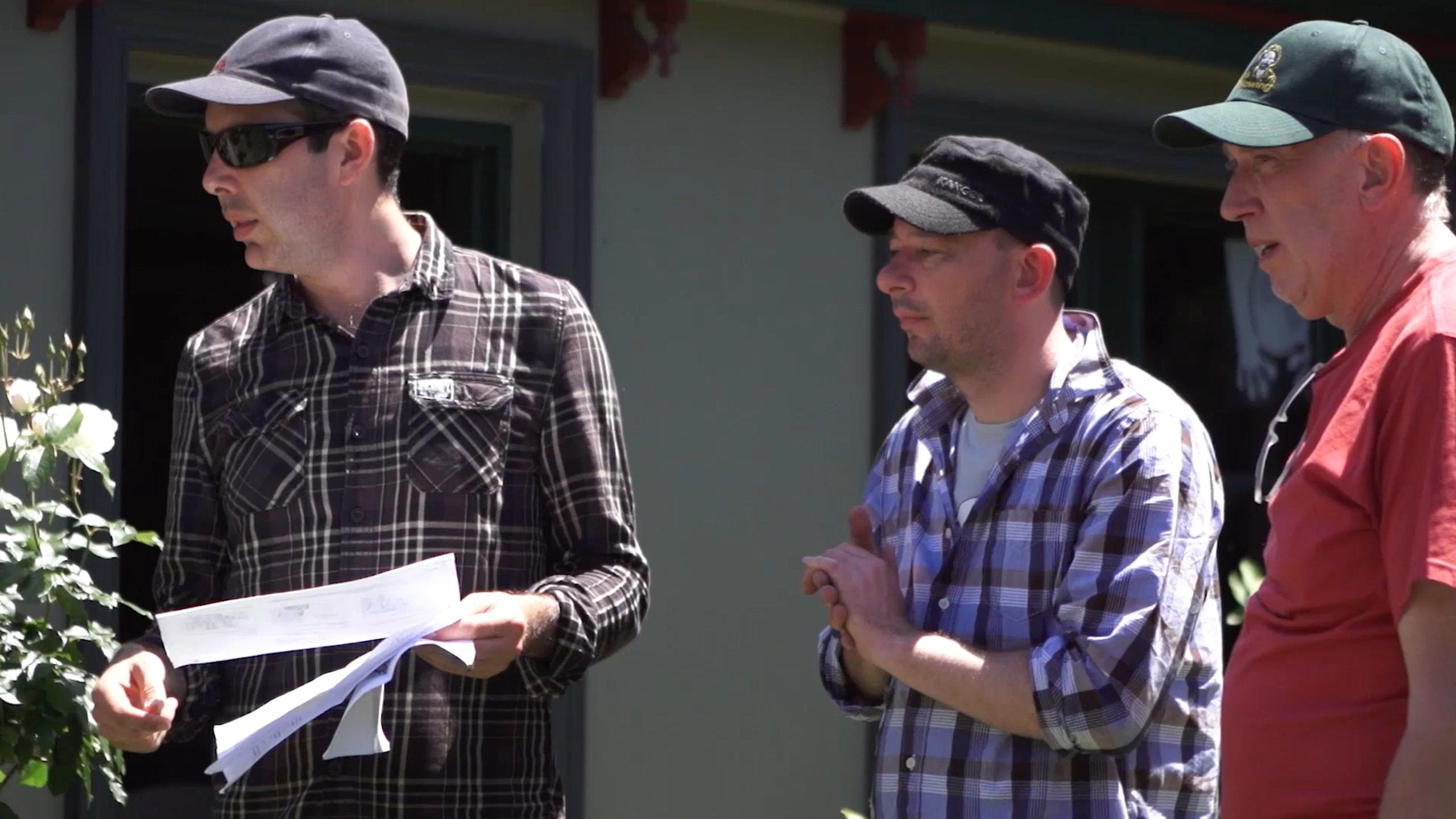 Dream Engine production team reviewing printed shot plans before filming