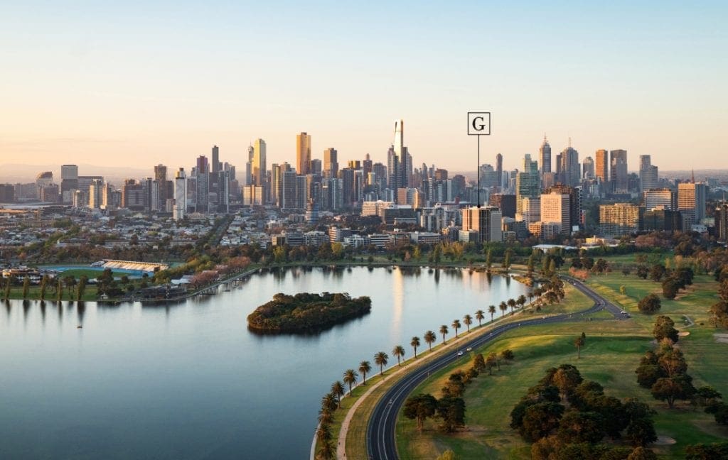 Albert Park Lake, parkland and the Melbourne city skyline in an older aerial view.
