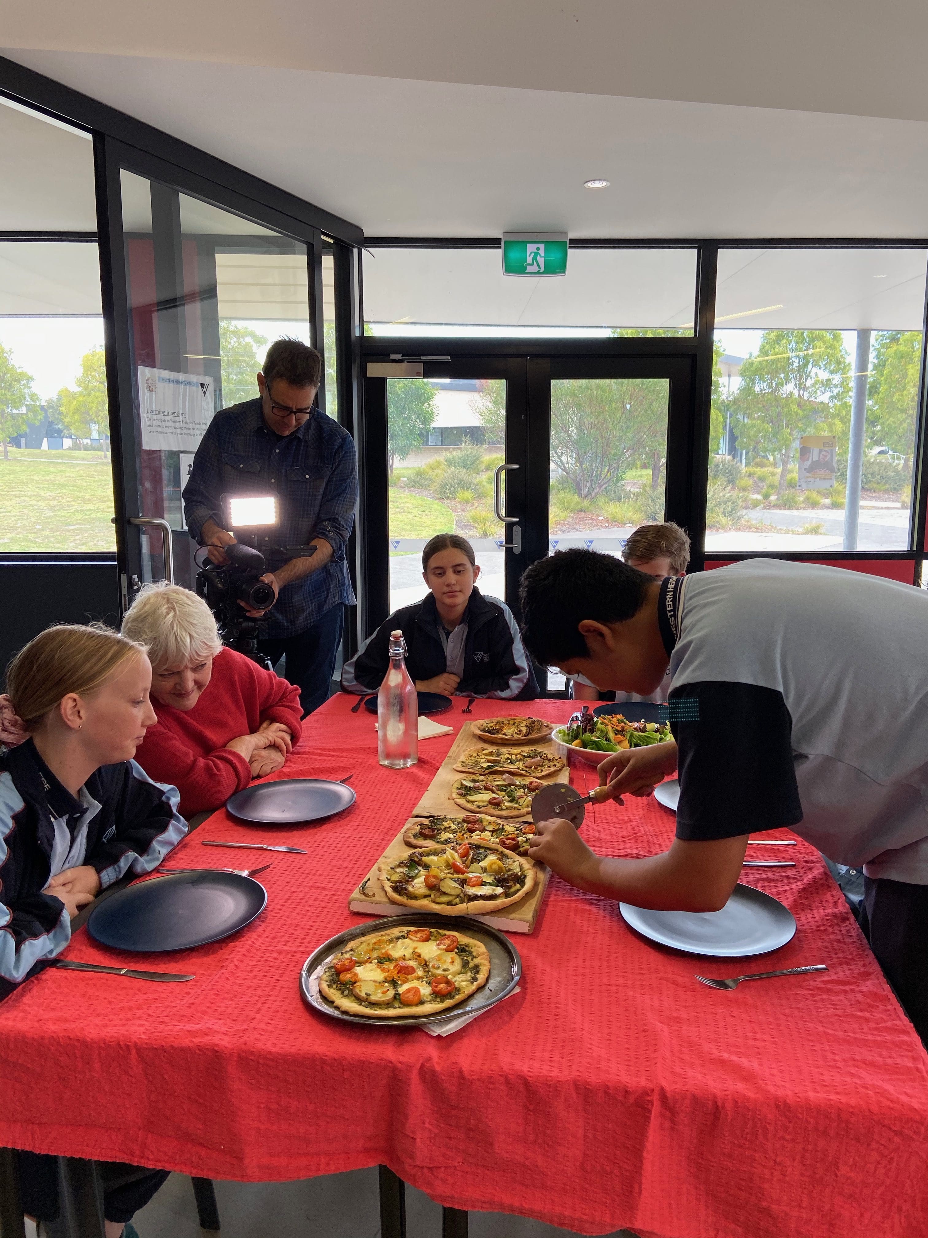 Dream Engine filming a school community story around a shared table