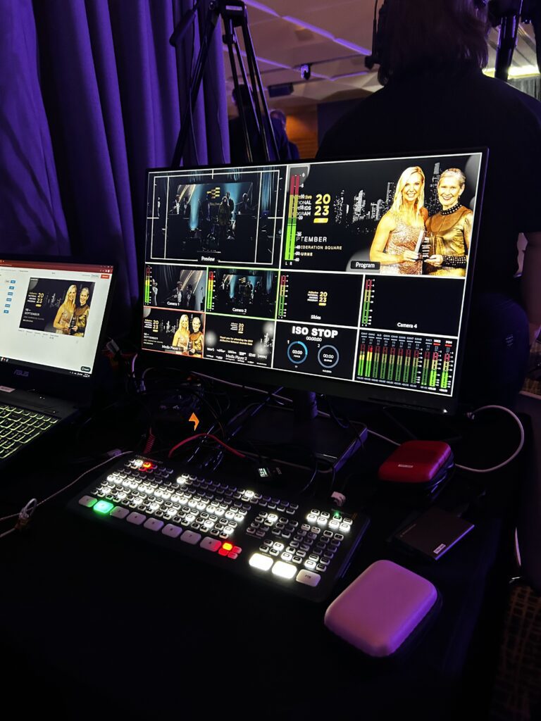 livestreaming computer equipment on a table at an event centre.