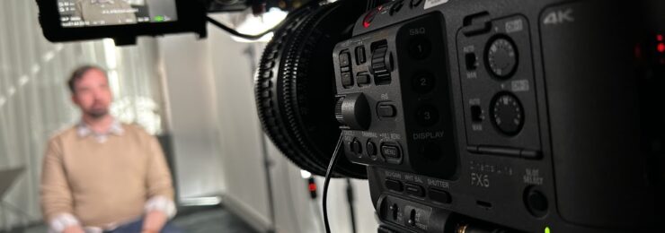 man being interviewed on camera