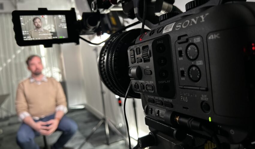 man being interviewed on camera