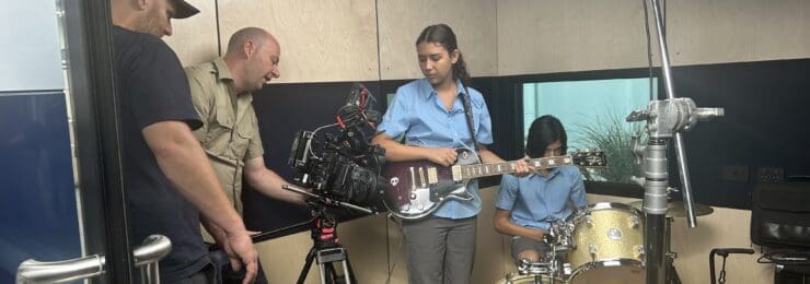 camera crew filming a band