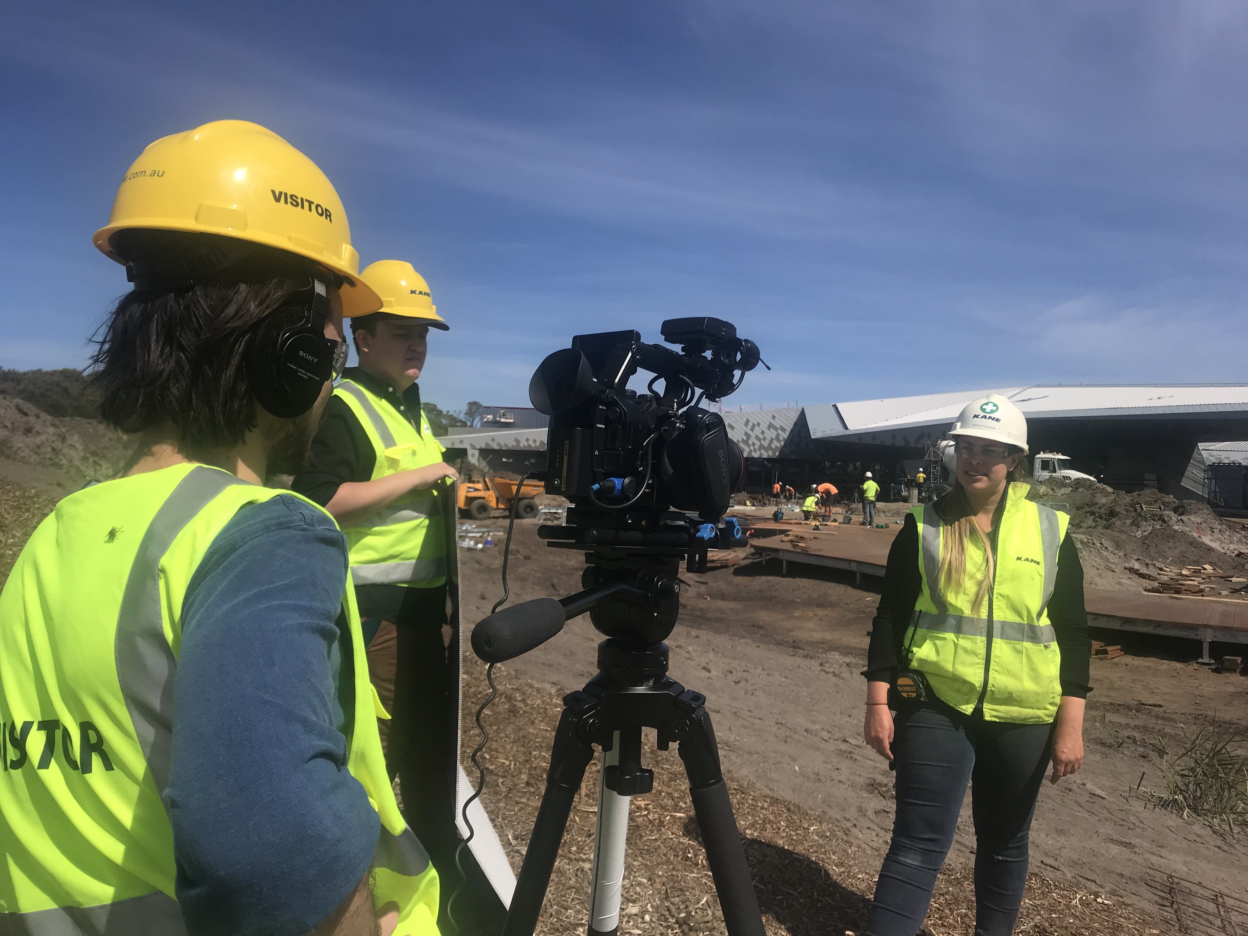 Dream Engine camera crew filming an interview safely on an active industrial site