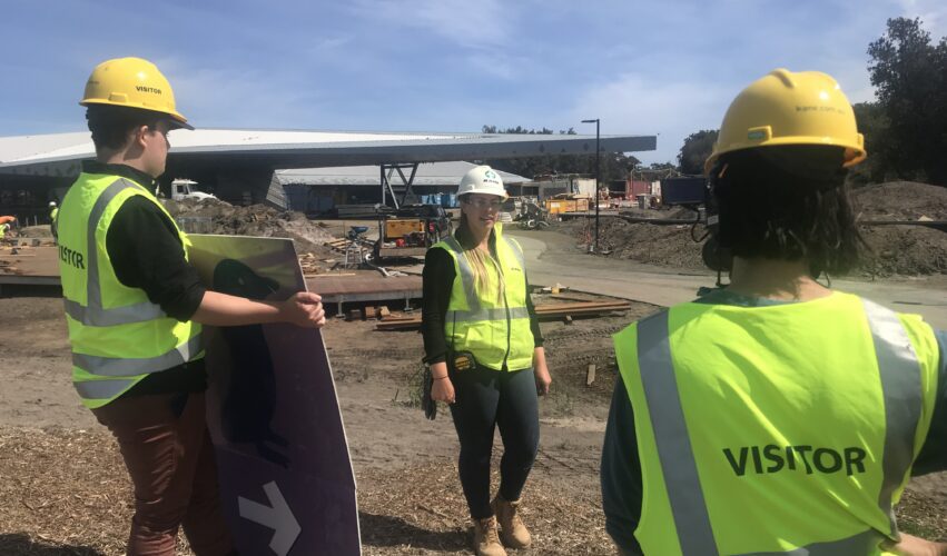 production assistant holding a reflector for a video interview