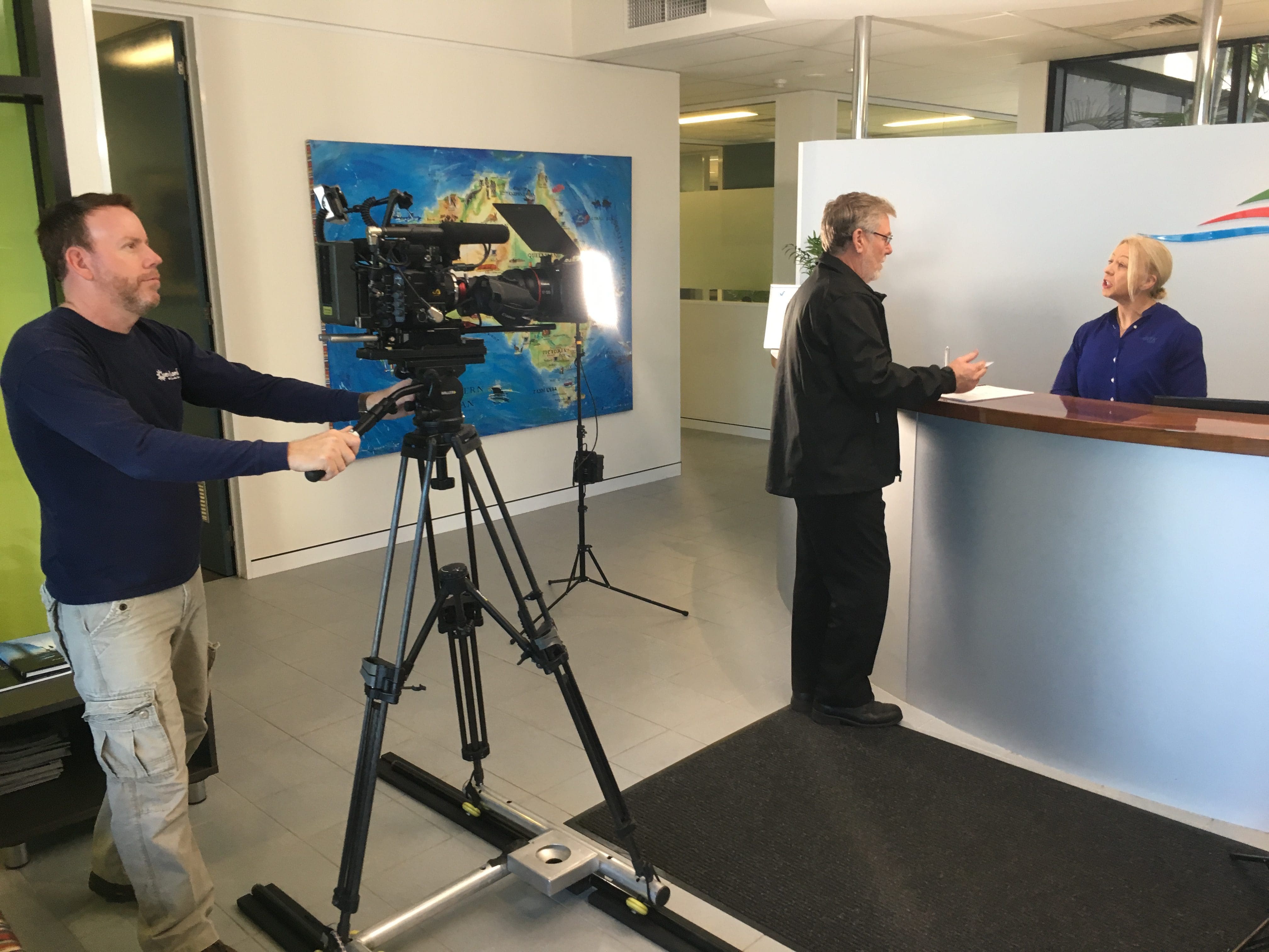 Dream Engine crew filming a corporate video in a client's office reception area