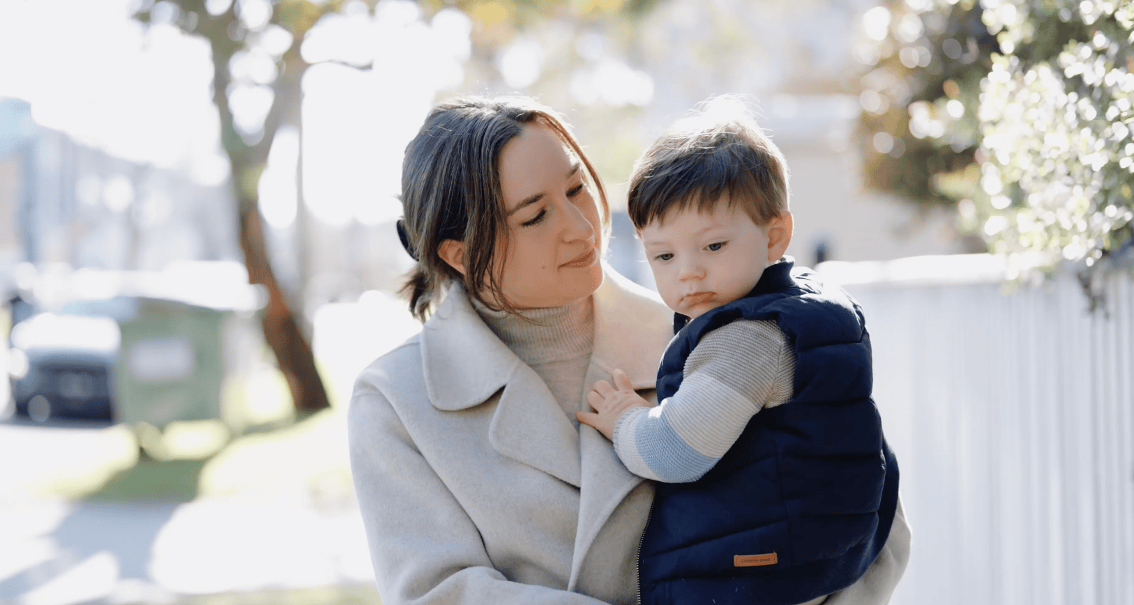 Parent holding a young child outdoors during filming for the City of Boroondara Maternal and Child Health video series