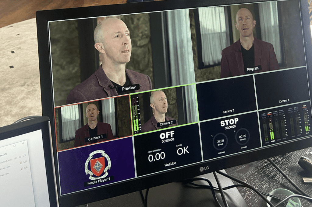 man on webinar screen