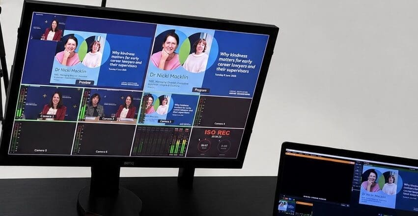 Live webinar production control screen showing multi-camera switching, presentation slides and live monitoring during a Victorian Legal Services Board webinar.