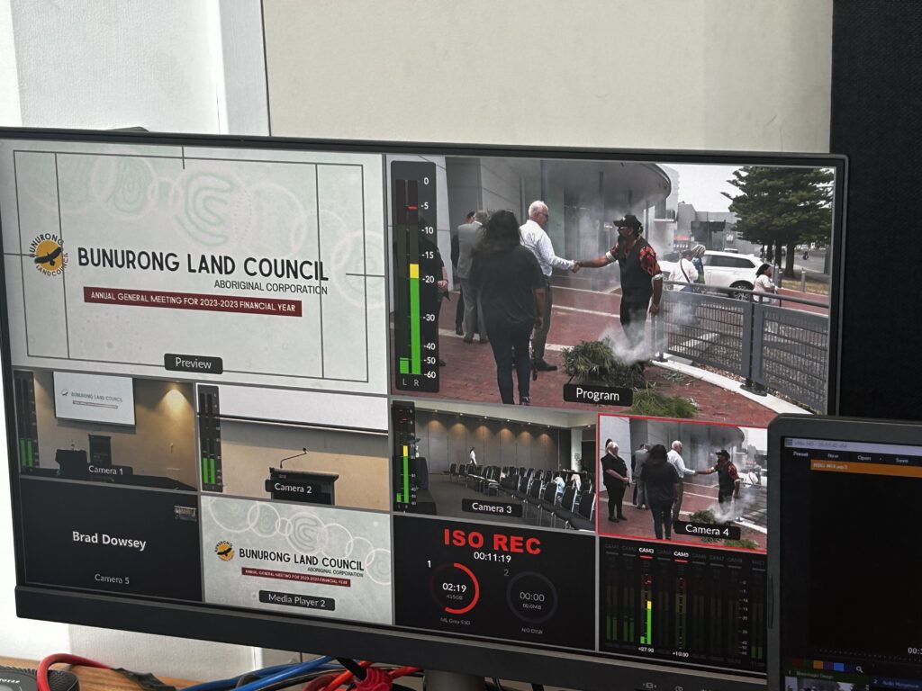 Live production control room for the Bunurong Land Council AGM featuring four-camera live streaming, wireless coverage of the Smoking Ceremony, PowerPoint integration and hybrid event broadcasting.