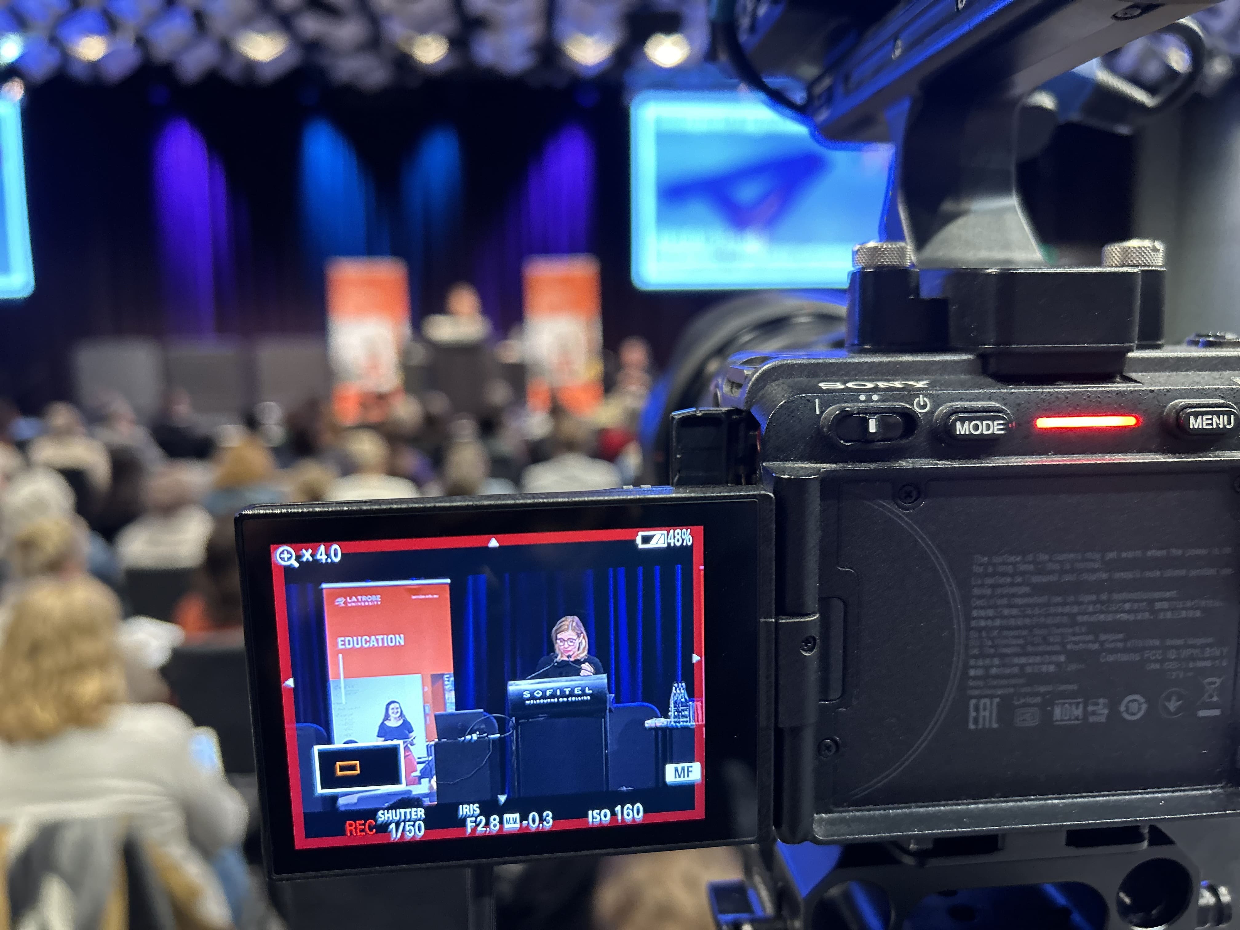 Dream Engine camera recording a speaker at a live education event