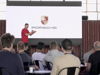 Audience attending the Porsche Excite! corporate training event in Melbourne during a keynote presentation