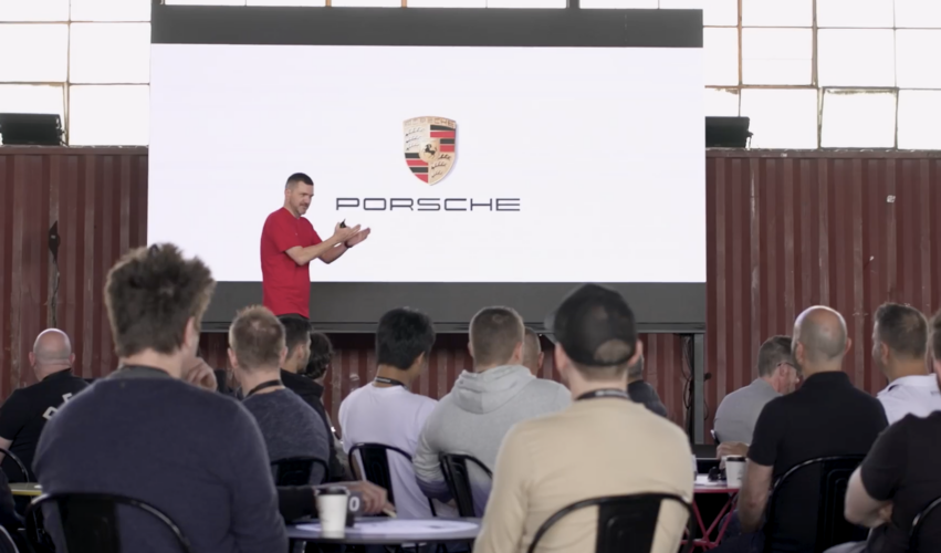 Audience attending the Porsche Excite! corporate training event in Melbourne during a keynote presentation