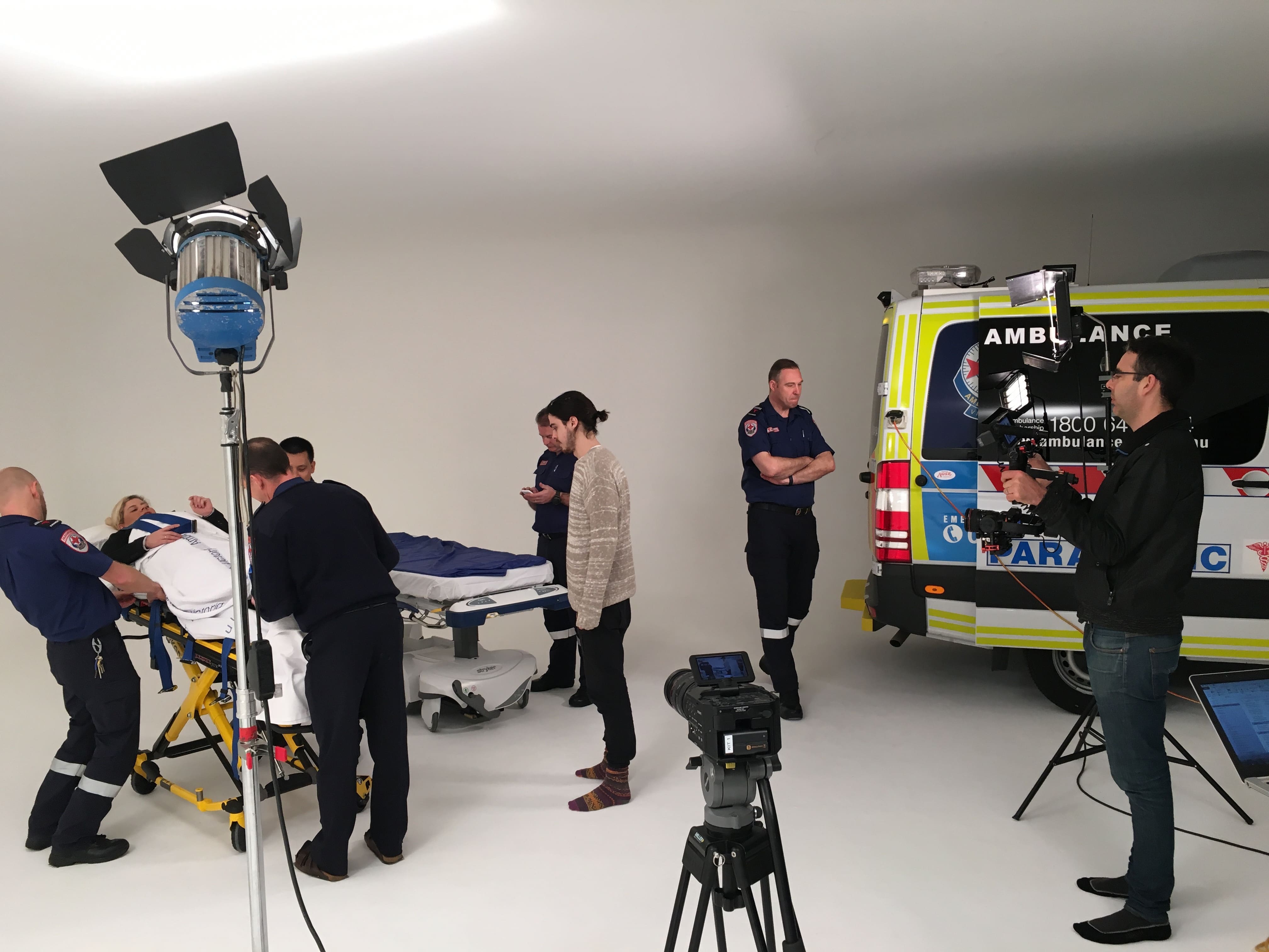 Dream Engine camera crew filming a healthcare scene with ambulance staff in a studio