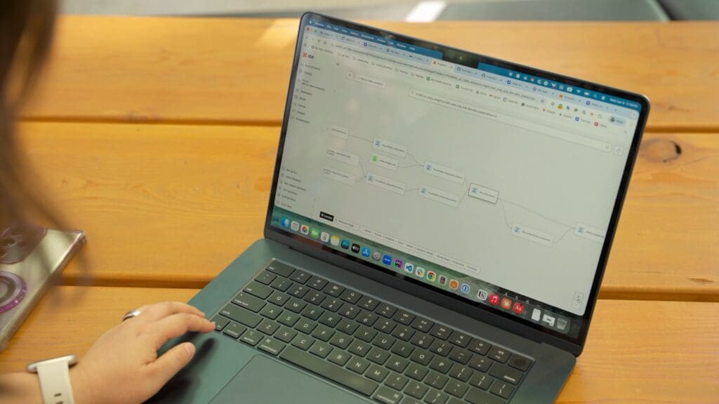 The dbt platform lineage graph displayed on a laptop during the SafetyCulture customer story