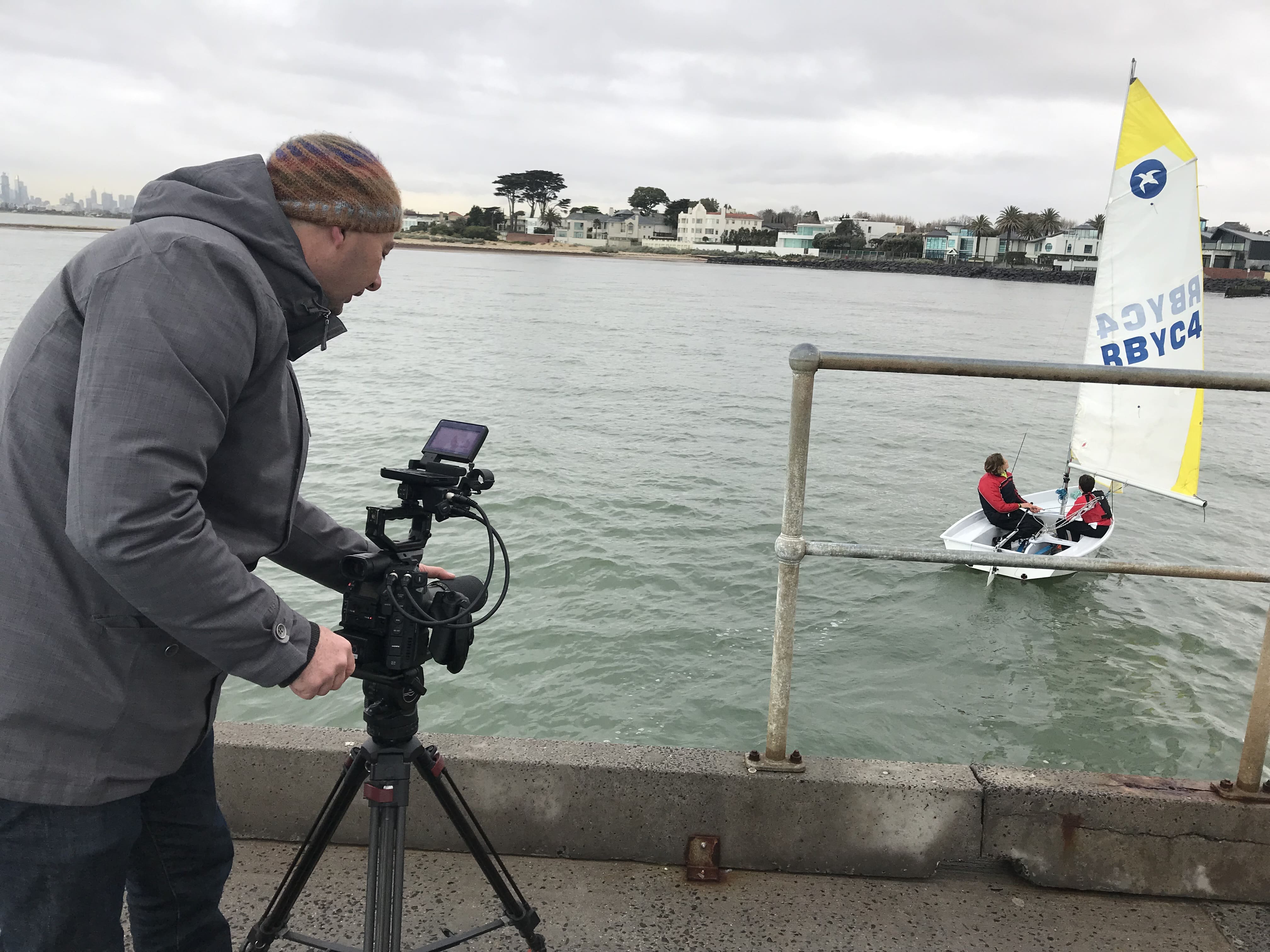 Dream Engine camera operator filming Brighton Grammar students sailing on Port Phillip Bay