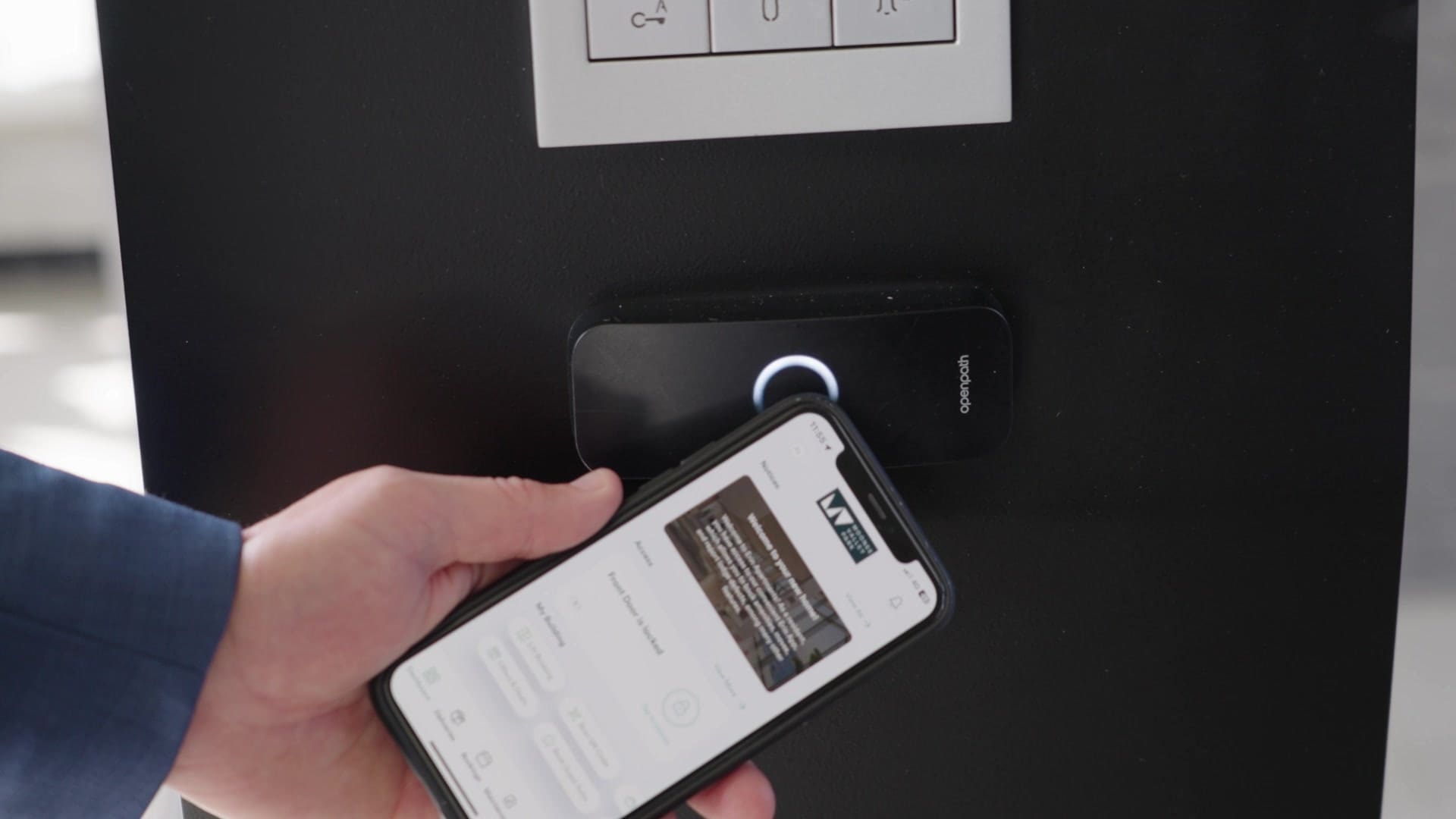 Erin Resident app activating an Avigilon Alta access control reader
