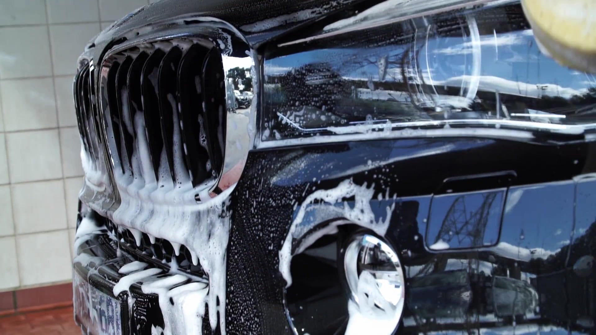 BMW vehicle being washed during a Seal and Protect training demonstration