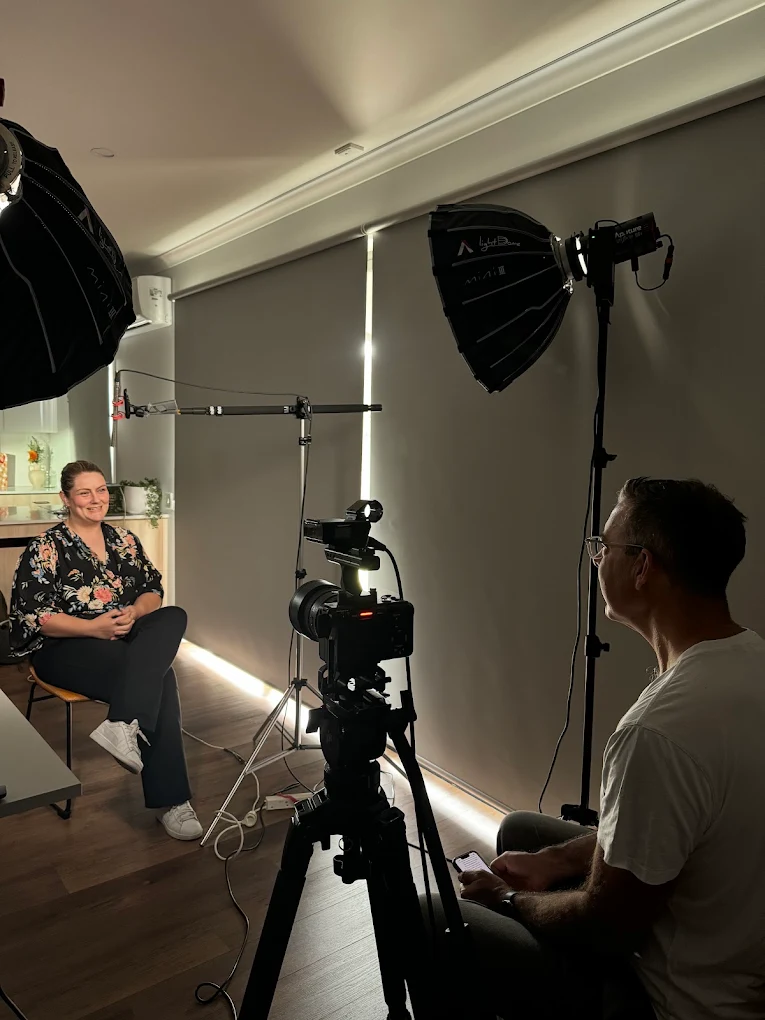 Compact Dream Engine corporate interview setup with a camera, softbox lighting and boom microphone