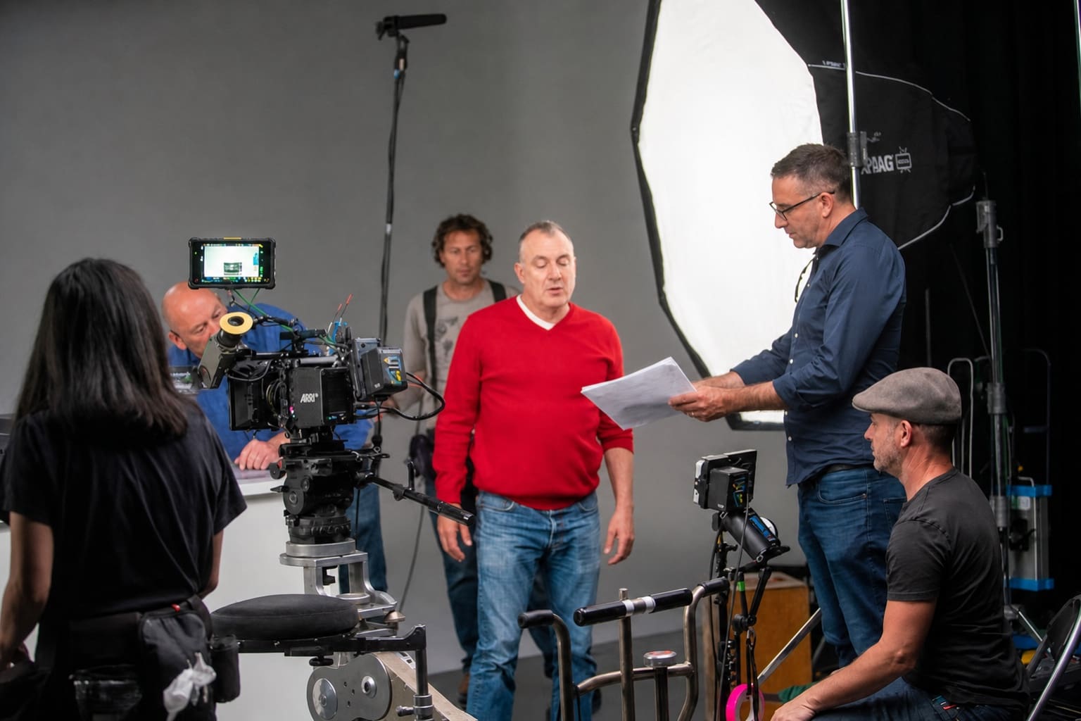 Dream Engine director reviewing the script with Jimeoin and the camera crew during the Epson EcoTank TV commercial shoot