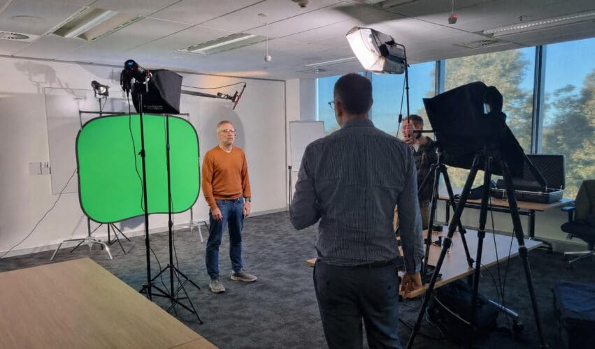 Dream Engine director guiding a presenter during a corporate video shoot in Melbourne