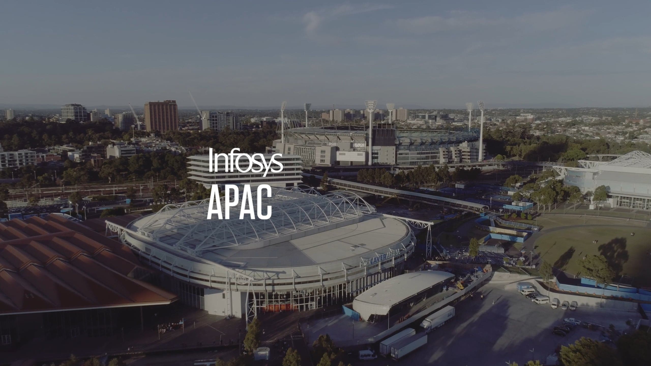 Aerial view of Melbourne Park with an Infosys APAC title from the Confluence highlights film