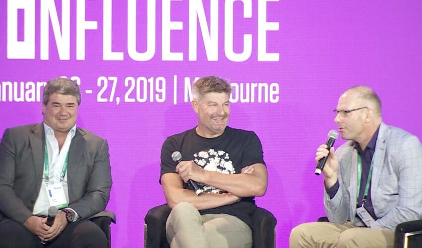 Three speakers taking part in a panel discussion at Infosys APAC Confluence in Melbourne