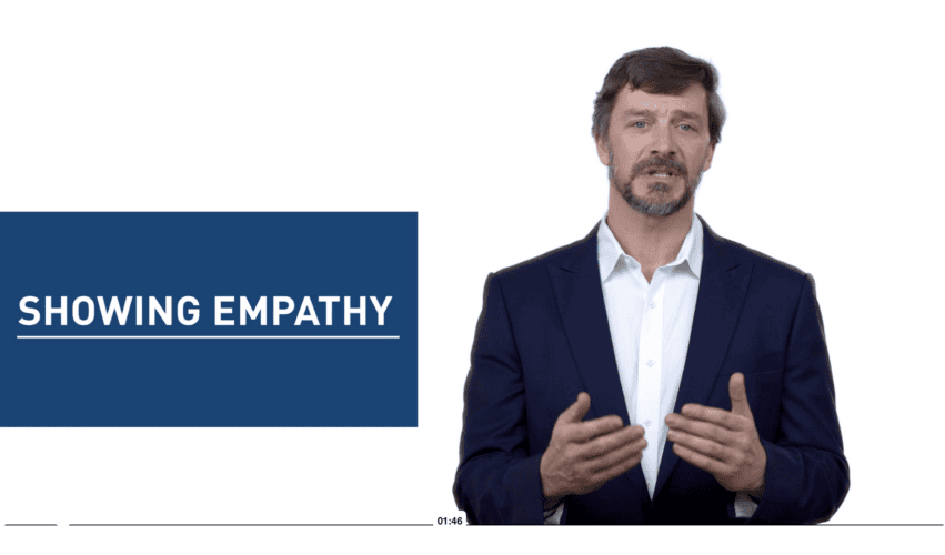 Presenter beside motion graphics text reading Showing Empathy in an OPP Victoria animated training module.