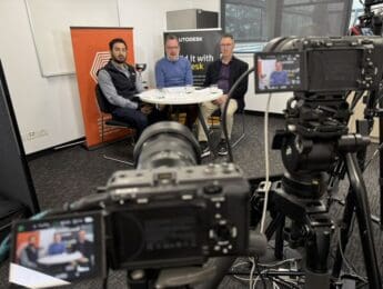 Three Autodesk Challenge Cup hosts seated at a multi-camera livestream studio at Melbourne Polytechnic's Broadmeadows campus
