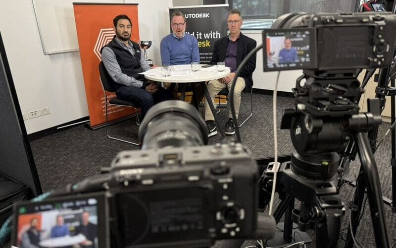 Three Autodesk Challenge Cup hosts seated at a multi-camera livestream studio at Melbourne Polytechnic's Broadmeadows campus