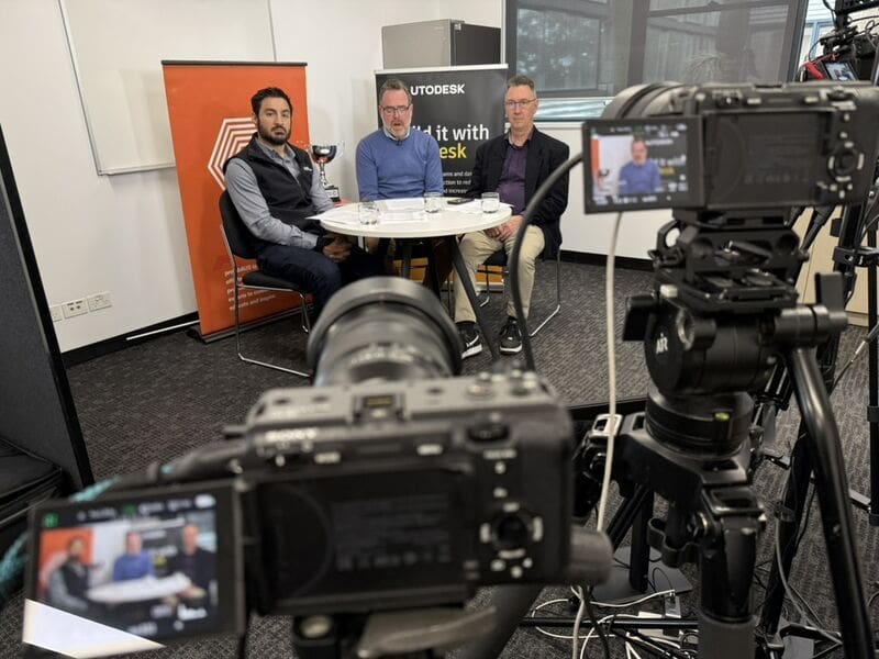 Three Autodesk Challenge Cup hosts seated at a multi-camera livestream studio at Melbourne Polytechnic's Broadmeadows campus
