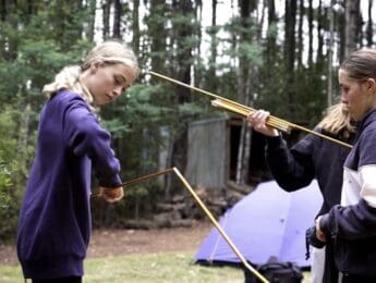 Students assembling tent poles during a campcraft activity at Rubicon Outdoor School