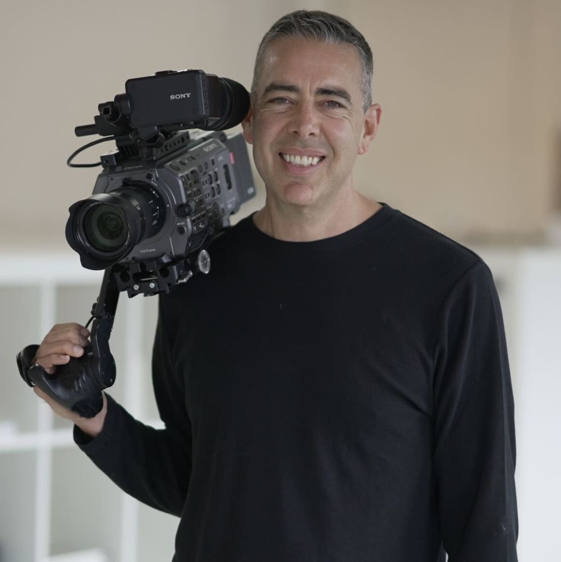 Ryan Spanger holding a Sony FX9 video camera