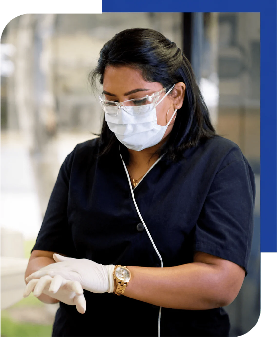 Healthcare worker demonstrating how to put on gloves during training filming