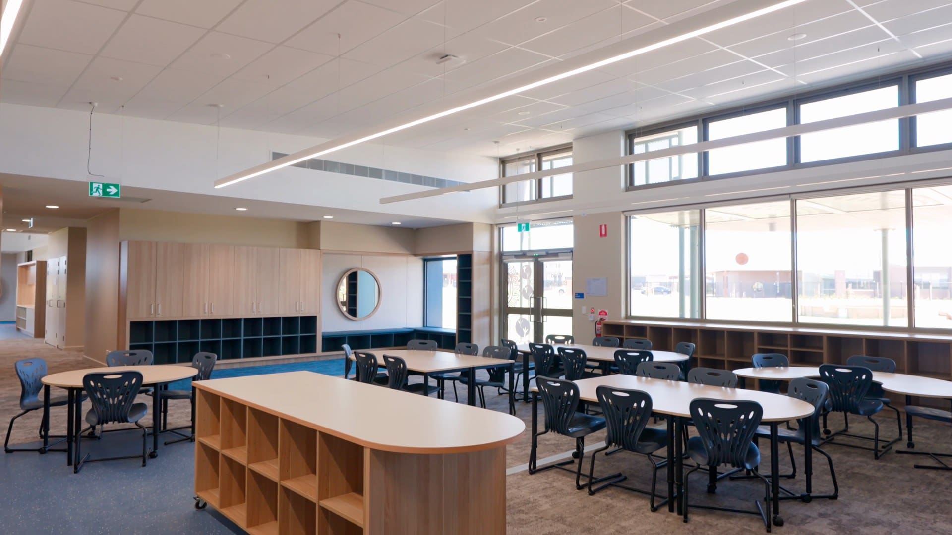 Tables, chairs and shared learning space inside a new classroom at Barayip Primary School