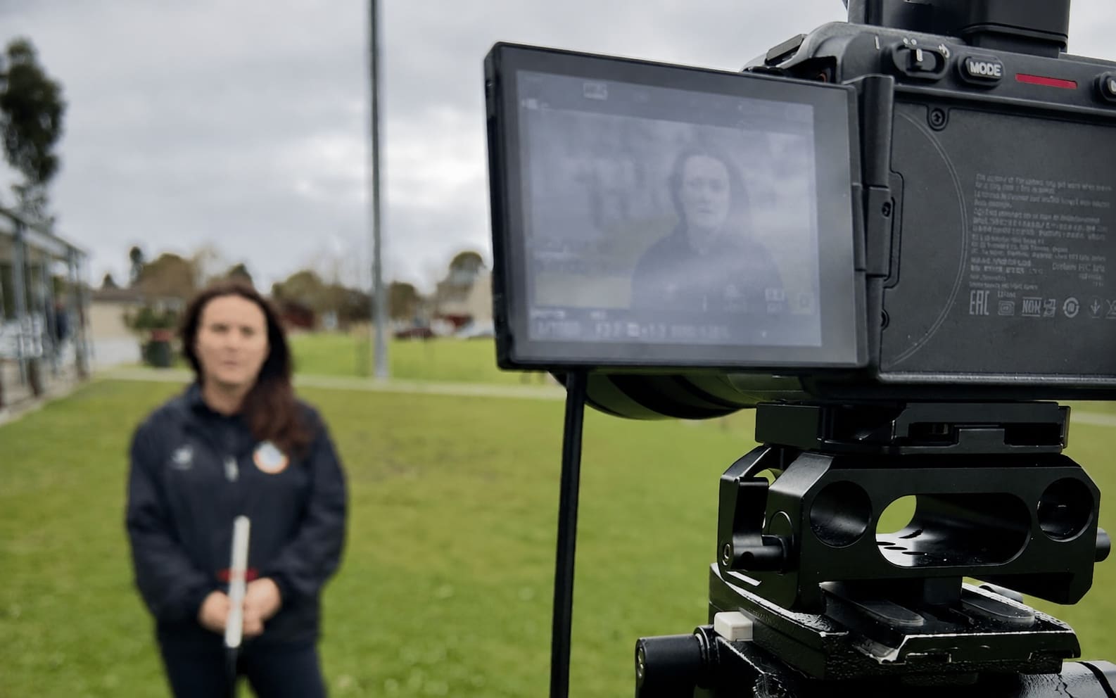 Camera recording a Change Makers program participant speaking about inclusion in community sport
