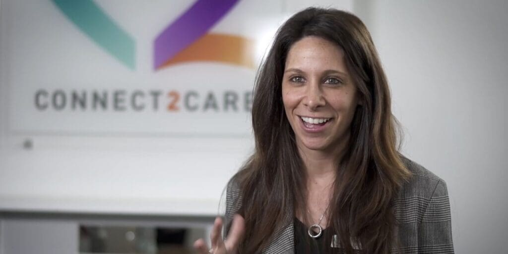 An interview contributor with Connect2Care branding visible behind her.